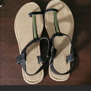 Black thong sandal with gold accent.